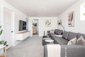 a living room with a couch and a tv at Well-Stocked, Family Friendly Home on the Westside STR-1669 in Colorado Springs