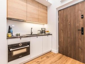 Kuchyňa alebo kuchynka v ubytovaní Rent like home - Księcia Józefa Poniatowskiego 2