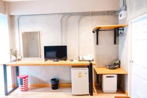 an office with a desk with a computer on it at Sea Sand Trees in Bangsaen