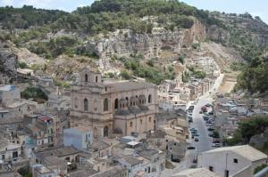 an aerial view of a city with a mountain at Anticu Dammusu in Scicli