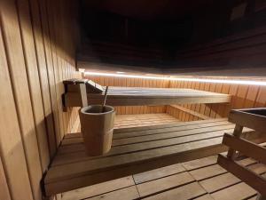 a sauna with a trash can in the middle at Logis Hotel Center in Brest