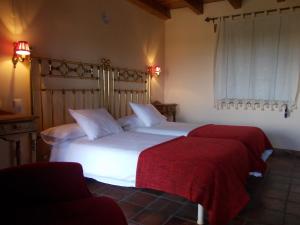 Tempat tidur dalam kamar di Hotel Los Rastrojos