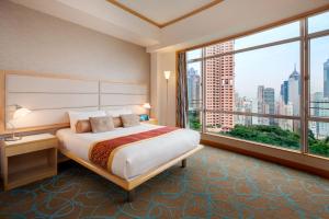 Postel nebo postele na pokoji v ubytování Garden View Hong Kong