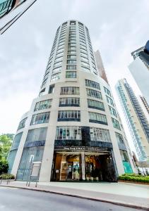 a tall white building with a lot of windows at Garden View Hong Kong in Hong Kong