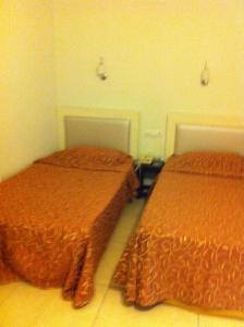Postel nebo postele na pokoji v ubytování Hotel Vanilla