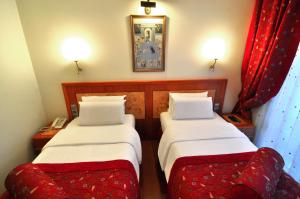 Postel nebo postele na pokoji v ubytování Santa Ottoman Hotel