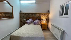 Posteľ alebo postele v izbe v ubytovaní Apartamentos Rurales Casa Josefita