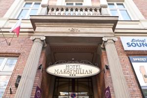 a sign on the front of a building at Hotel Maksymilian in Krakow