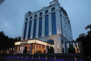 a large building with lights in front of it at Quality Inn Sabari in Chennai