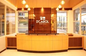 a dressing room with a display case in a store at D'Carol Hotel in Surabaya