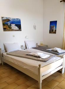 Postel nebo postele na pokoji v ubytování Το Κατἑ