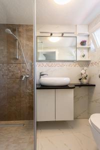a bathroom with a shower and a sink at Villa Beganović in Krk
