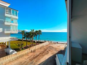 a view of the ocean from the balcony of a condo at Cap Negret 15 in Altea