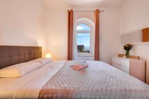 Säng eller sängar i ett rum på Studio Apartment Vittoria