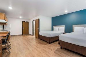 Postel nebo postele na pokoji v ubytování WoodSpring Suites Abilene