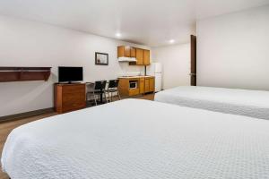 Postel nebo postele na pokoji v ubytování WoodSpring Suites Abilene