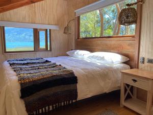 מיטה או מיטות בחדר ב-Cabañas Almalik