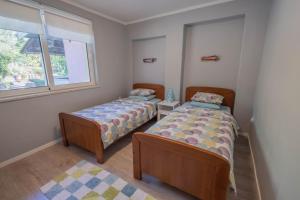 Postel nebo postele na pokoji v ubytování Apartmani Villa Mila