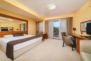 Krevet ili kreveti u jedinici u okviru objekta Hotel Podgorica