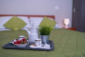 A bed or beds in a room at Green Residence