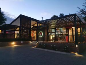 a large building with a lot of windows at Sleep@84 in Dullstroom
