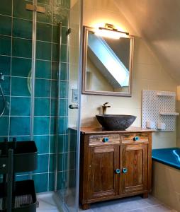 a bathroom with a sink and a mirror at Paradiesje 3 in Leer +30 photos