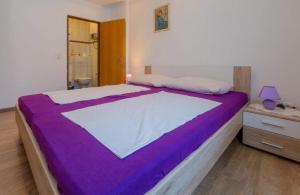 Postel nebo postele na pokoji v ubytování Navy Apartments