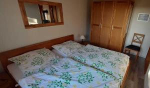 Postel nebo postele na pokoji v ubytování Ferienhaus Geltinger Birk