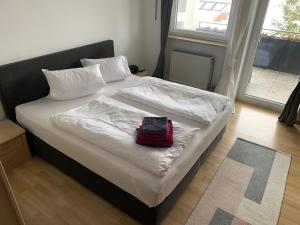 מיטה או מיטות בחדר ב-Apartment Schmuck