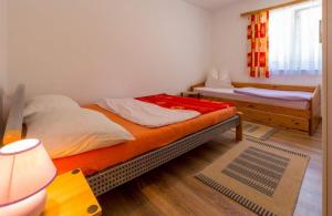 Postel nebo postele na pokoji v ubytování Navy Apartments
