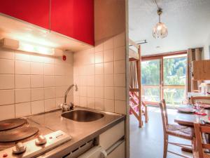 a kitchen with a sink and a counter top at Studio Soyouz Vanguard-10 by Interhome in Le Corbier