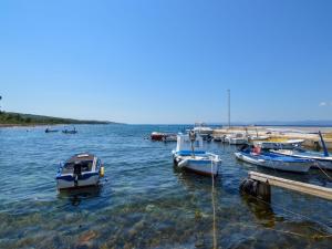 a group of boats docked at a dock in the water at Apartment Mira-2 by Interhome in Mirce
