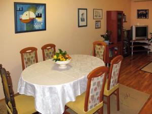 a dining room table with a bowl of fruit on it at Apartment Mira-2 by Interhome in Mirce