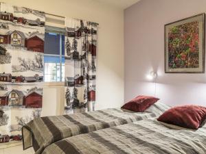 En eller flere senge i et værelse på Holiday Home Levi star 915 by Interhome