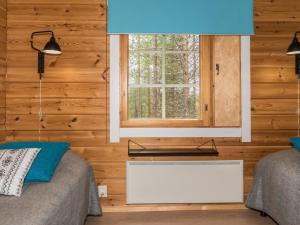 Postel nebo postele na pokoji v ubytování Holiday Home Lomaylläs b39 -suppapolku 6b by Interhome