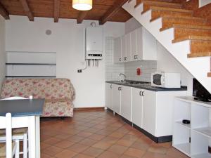 a small kitchen with a sink and a microwave at Apartment Ca' Pignoi-6 by Interhome in Garda