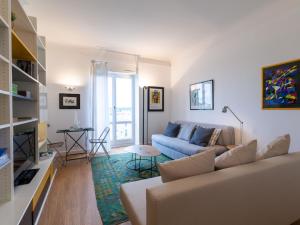 a living room with a couch and a table at Studio Regina by Interhome in Biarritz
