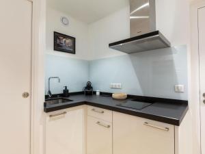 a small kitchen with a sink and a stove at Studio Regina by Interhome in Biarritz