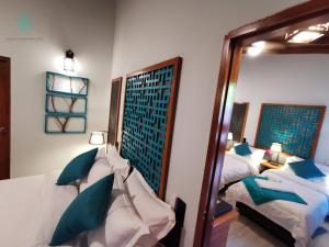 Postel nebo postele na pokoji v ubytování Village Hideaways & Spas
