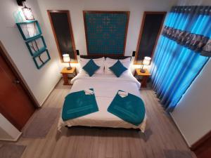 Postel nebo postele na pokoji v ubytování Village Hideaways & Spas