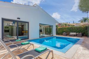 a swimming pool in the backyard of a house at Son Veri Vell in El Arenal