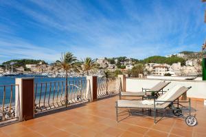 an apartment balcony with a view of the water at Sa Caleta in Port de Soller