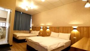 Voodi või voodid majutusasutuse Duo Yuan Hua B&B toas