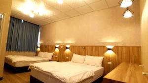 Voodi või voodid majutusasutuse Duo Yuan Hua B&B toas