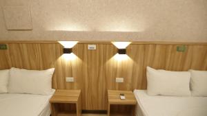 Voodi või voodid majutusasutuse Duo Yuan Hua B&B toas