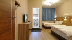 Voodi või voodid majutusasutuse Duo Yuan Hua B&B toas