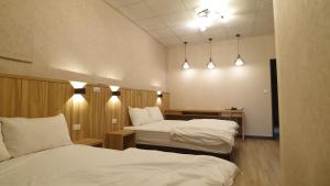Postel nebo postele na pokoji v ubytování Duo Yuan Hua B&B + 18 fotografií