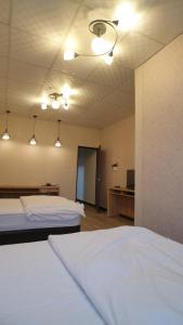 Voodi või voodid majutusasutuse Duo Yuan Hua B&B toas