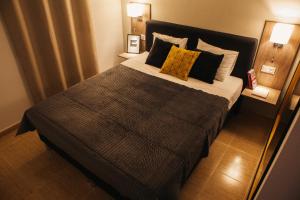 Postel nebo postele na pokoji v ubytování Aparthotel Costa Blanca
