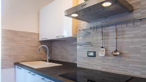a kitchen with a sink and a counter top at Appartamento di Daniele in Portoferraio +14 photos